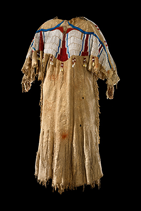 Walla Walla dress, ca. 1860â€“1880. Oregon. Deer hide, glass beads, cowrie shells, sinew. 135 x 145 cm. (1048)